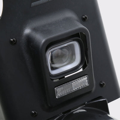 Close-up of the TXED Maverick headlight and front reflector.