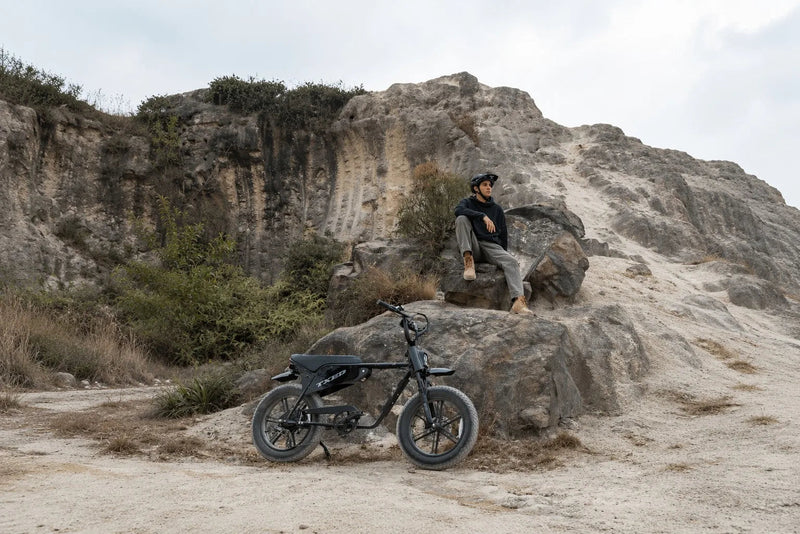 Maverick parked beside a rider taking a break outdoors