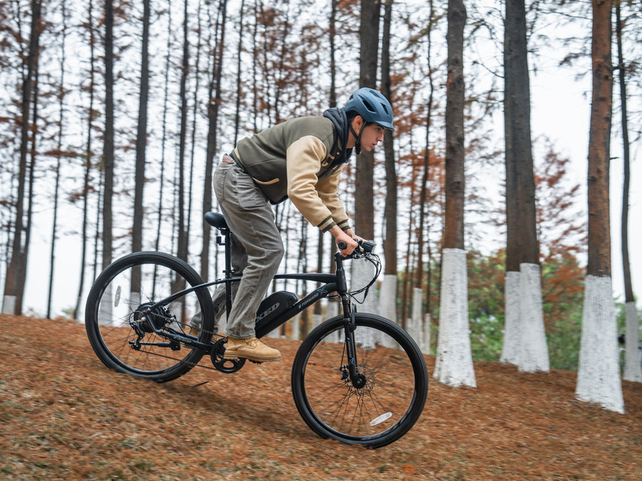 TXED Trail electric mountain bike ridden on a forest trail