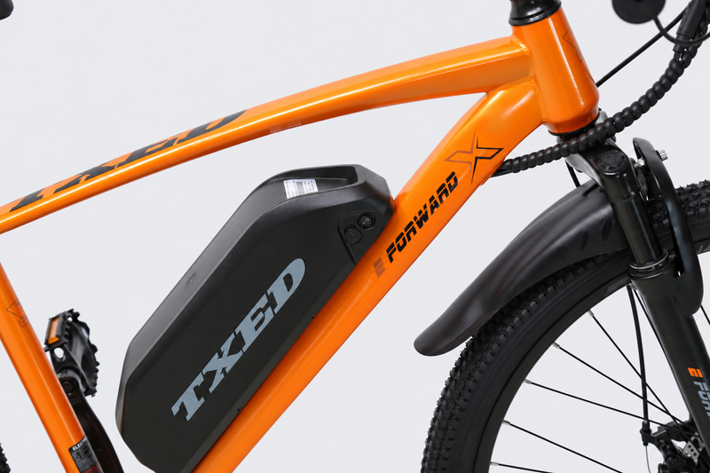 TXED Trail Orange 04 battery on light grey studio background
