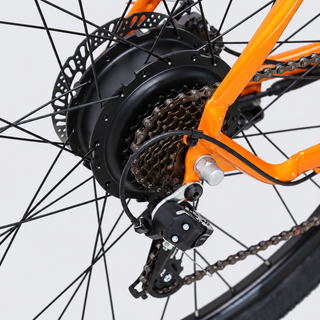 TXED Trail Orange 05 drivetrain on light grey studio background