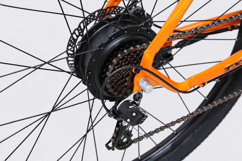TXED Trail Orange 05 drivetrain on light grey studio background